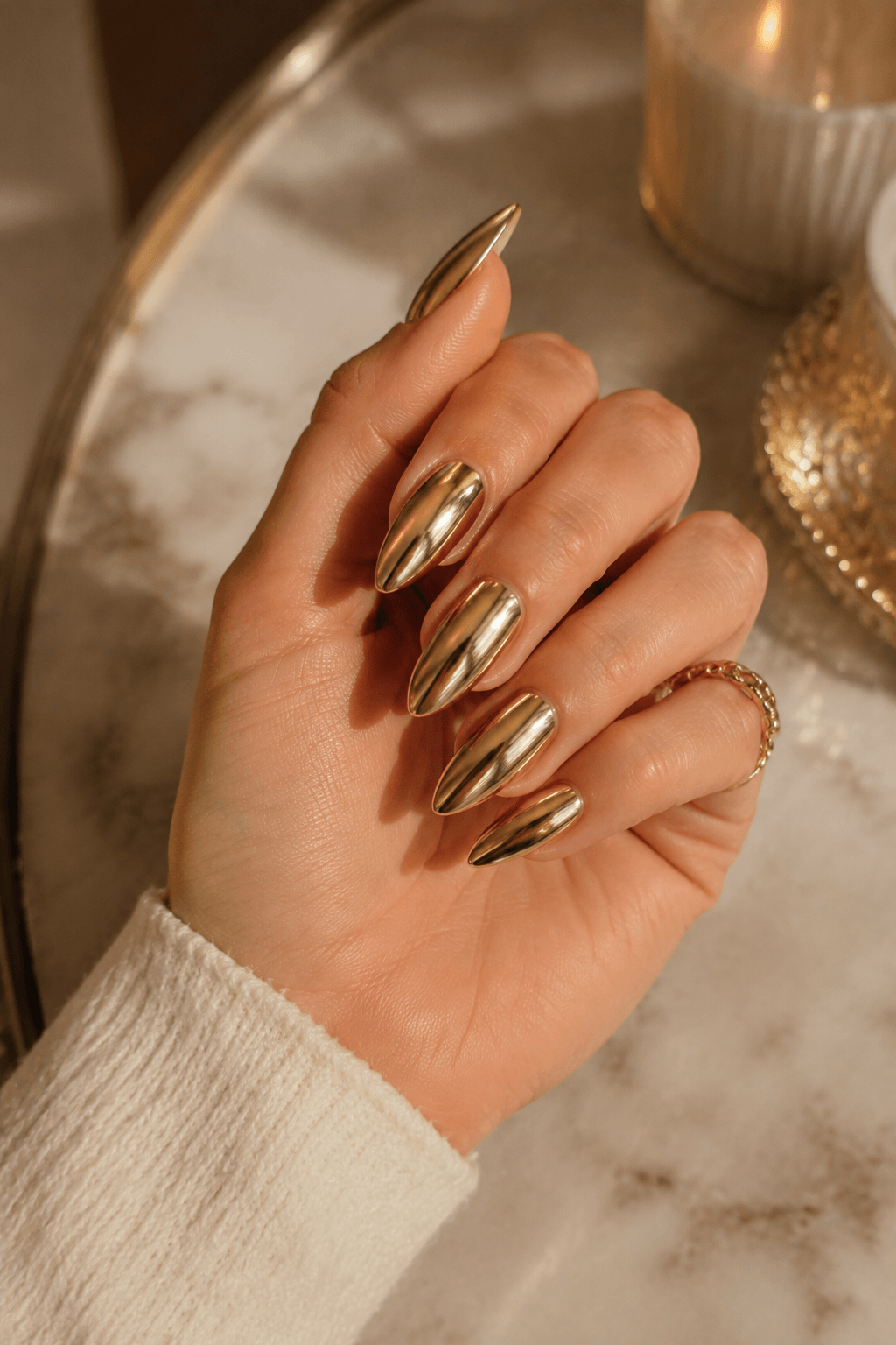 Gold Almond Nails with a Metallic Finish Gold Almond Nails with a Metallic Finish