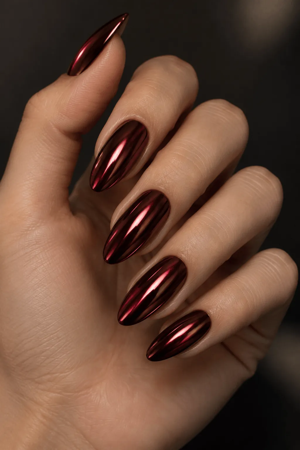Chrome Nail Ideas for a Night Out Deep burgundy chrome nails on almond nails for a night out