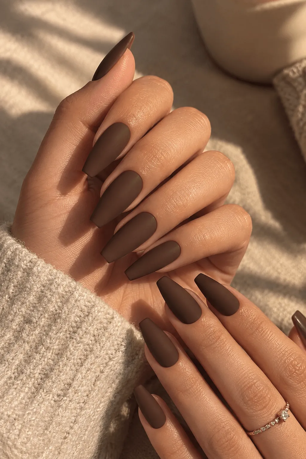 Gel Nail Ideas for Fall Matte chocolate brown gel nails on long almond nails for fall