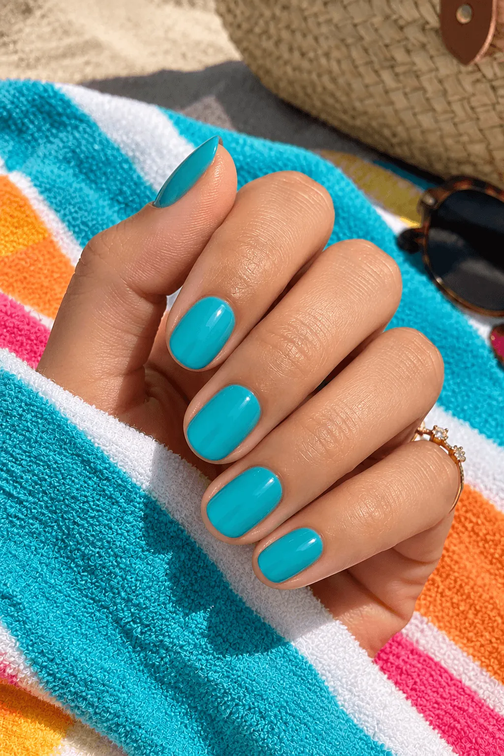 Gel Nail Ideas for Summer Bright turquoise glossy gel nails on short nails for summer