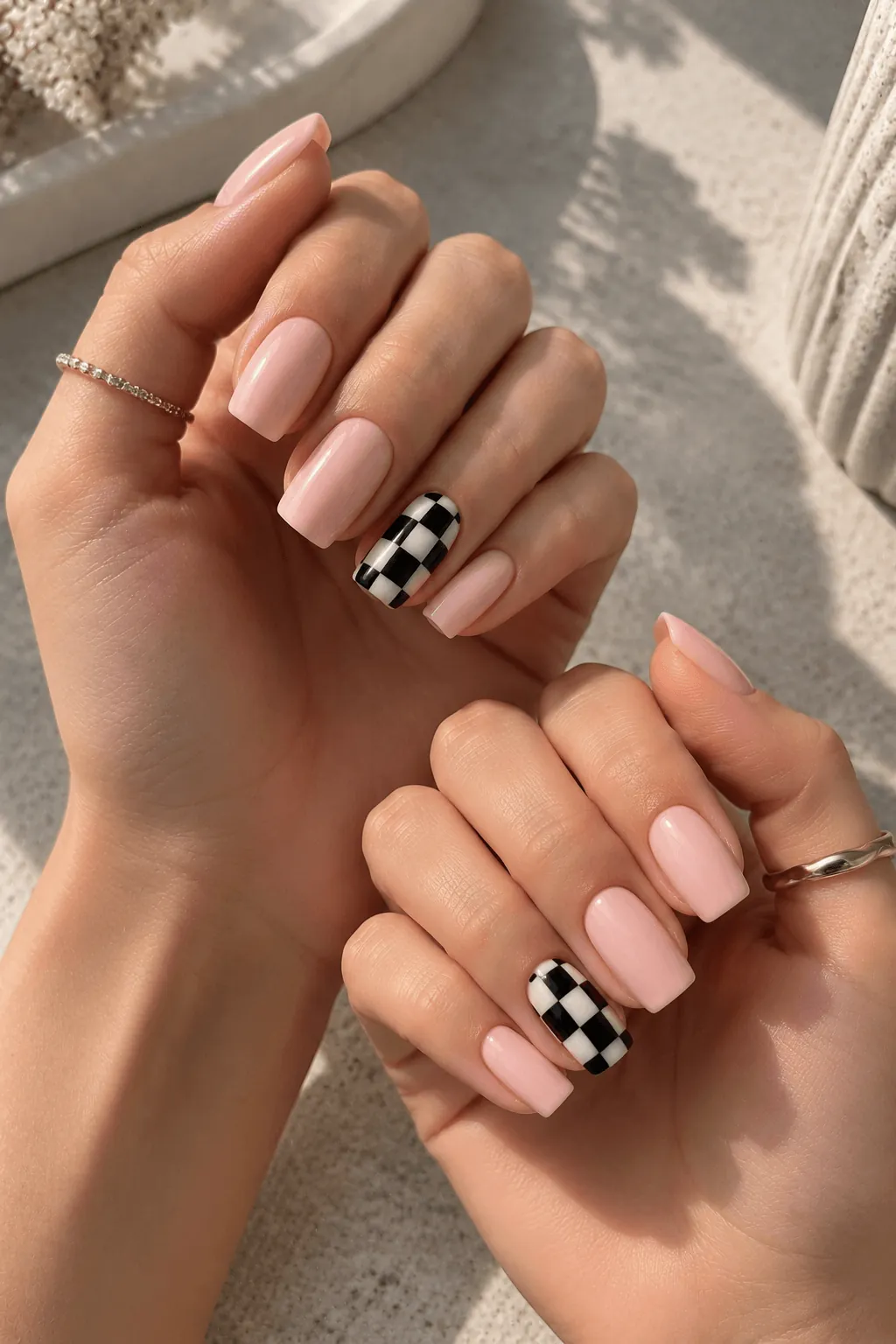 Nude Nail Art with a Checkerboard Accent Nude Nail Art with a Checkerboard Accent