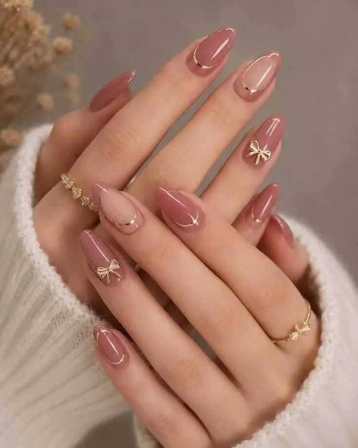 dukpini Nude Nail Art with Gold Curved Lines and Tiny Bow Charms Nude Nail Art with Gold Curved Lines and Tiny Bow Charms