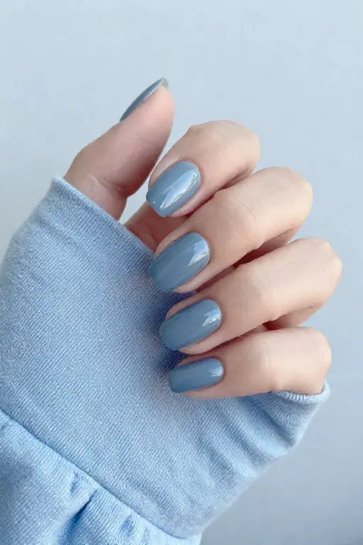 Slate Short square slate blue nails for late fall nail inspiration wearing a matching sweater