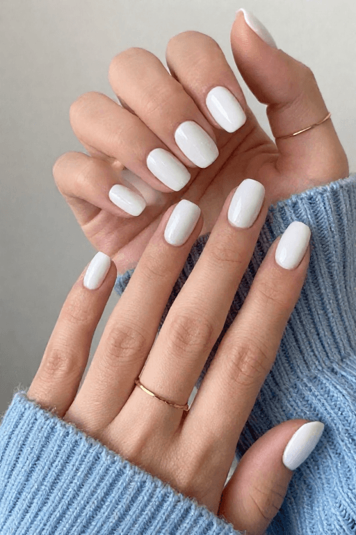 Medium nails in soft white polish with a smooth, even finish