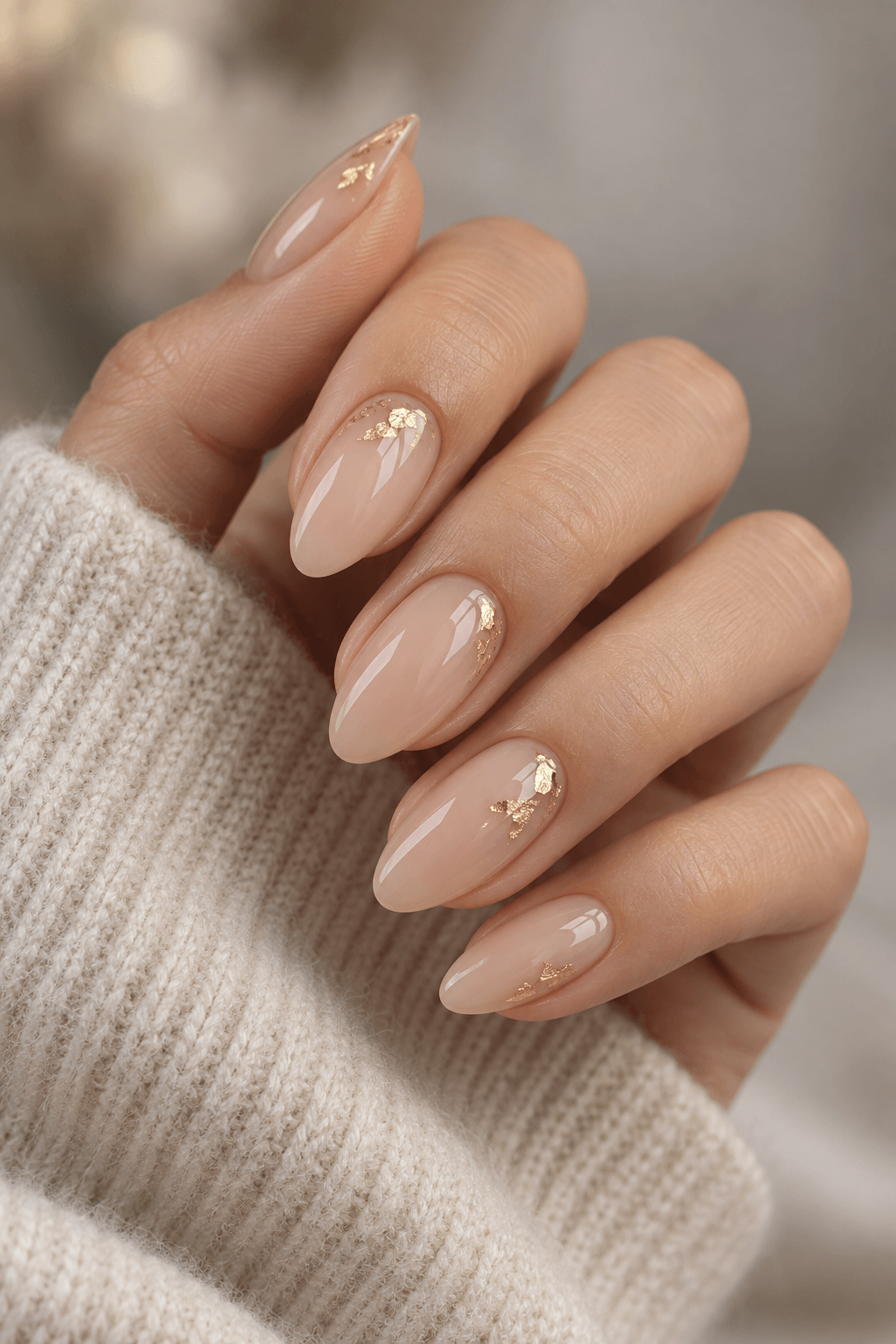 Thin Foil Flake Thin Foil Flake: Medium oval deep burgundy nails with one small gold foil flake near the cuticle on each ring finger