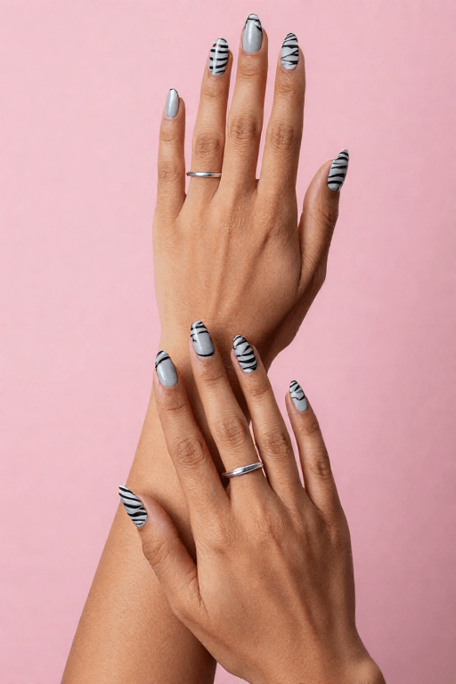 Zebra Stripes: Long almond soft gray nails with thin black zebra stripes